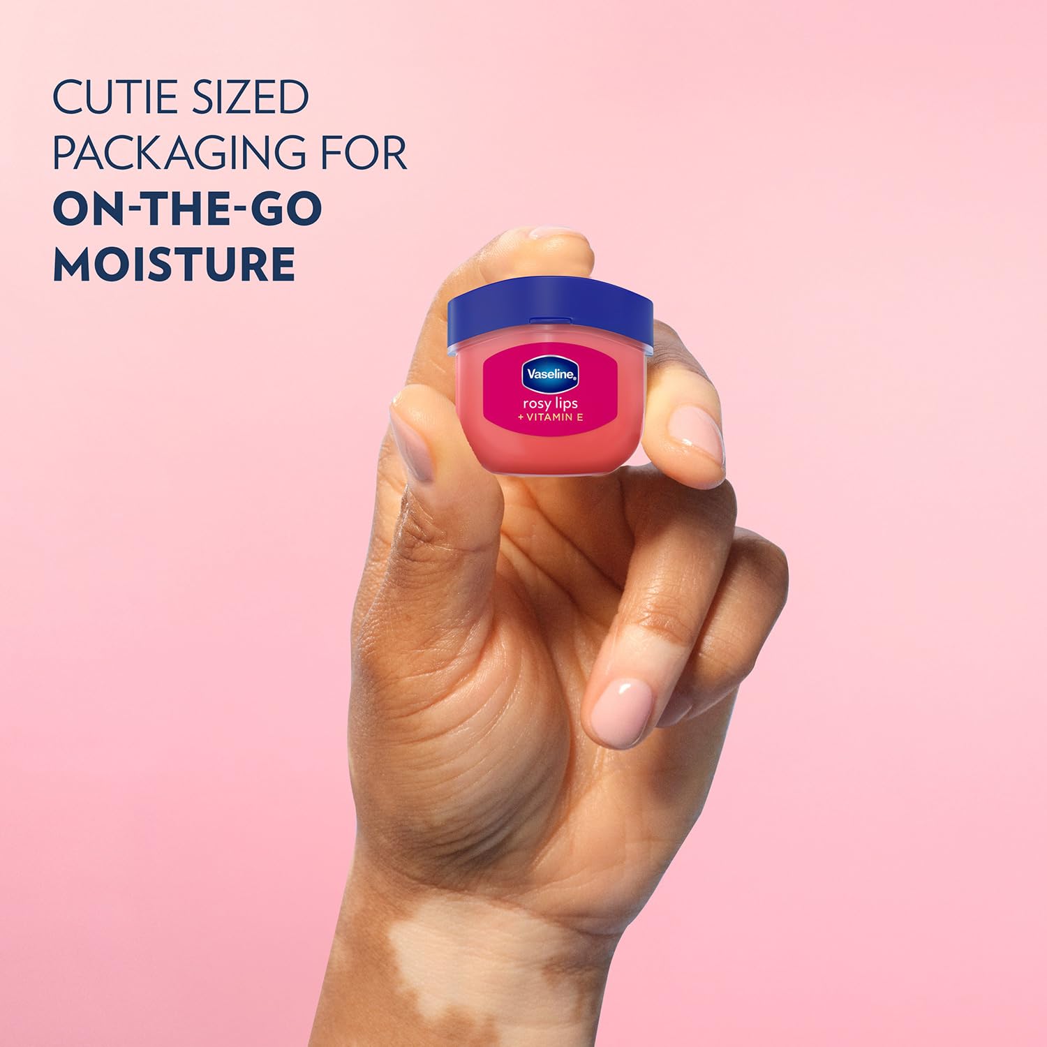 Vaseline mini jar inside a purse pocket for on-the-go hydration convenience