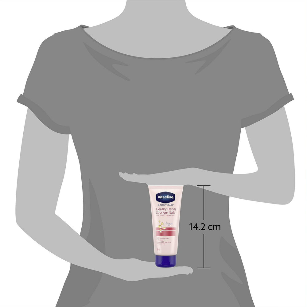 Vaseline tube next to passport and keys showing travel-friendly size