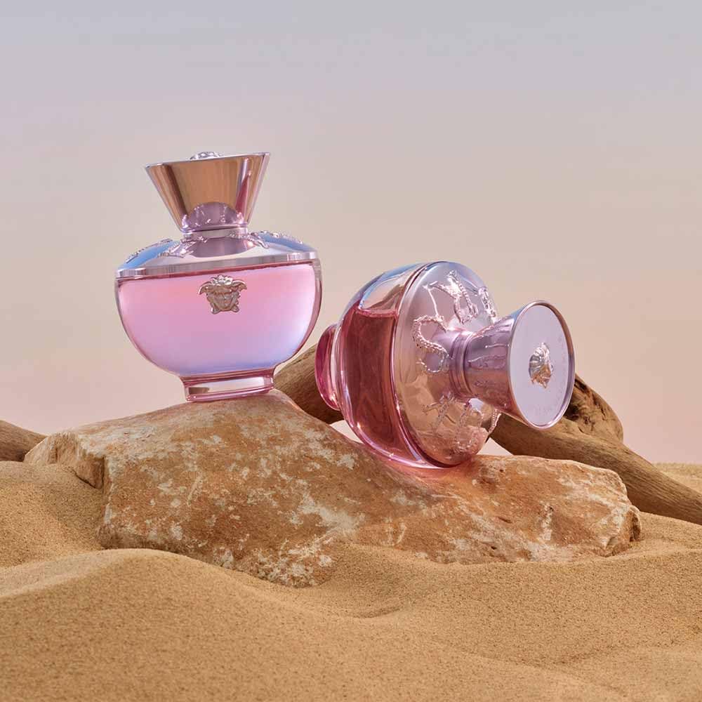 Versace Dylan Blush Pink bottle in hand to show 3.4 oz scale and portability for everyday use