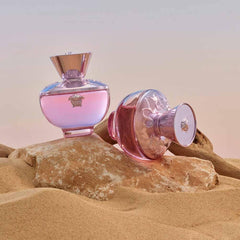 Versace Dylan Blush Pink bottle in hand to show 3.4 oz scale and portability for everyday use