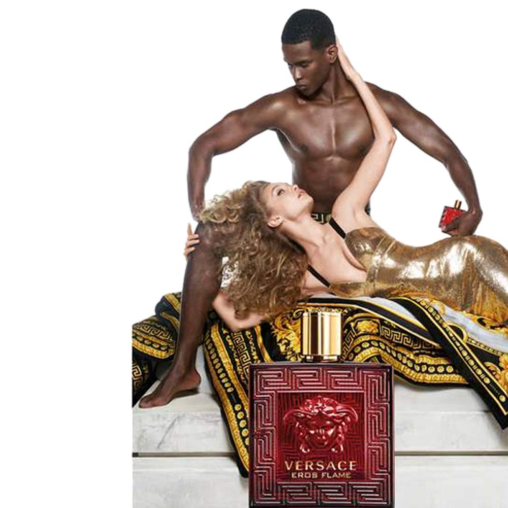 Versace Eros Flame being sprayed from a hand, demonstrating easy application