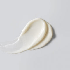 Versed Good Defense texture closeup demonstrating sheer, non-greasy feel