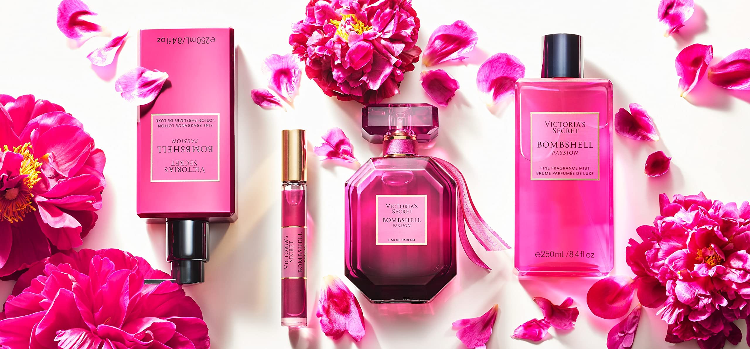 Victoria's Secret bottle beside a ruler illustrating the 3.4 fl oz size for travel planning