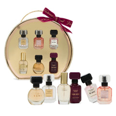 Victoria's Secret six mini bottles lined up top view showing variety benefit: compare fragrance options quickly