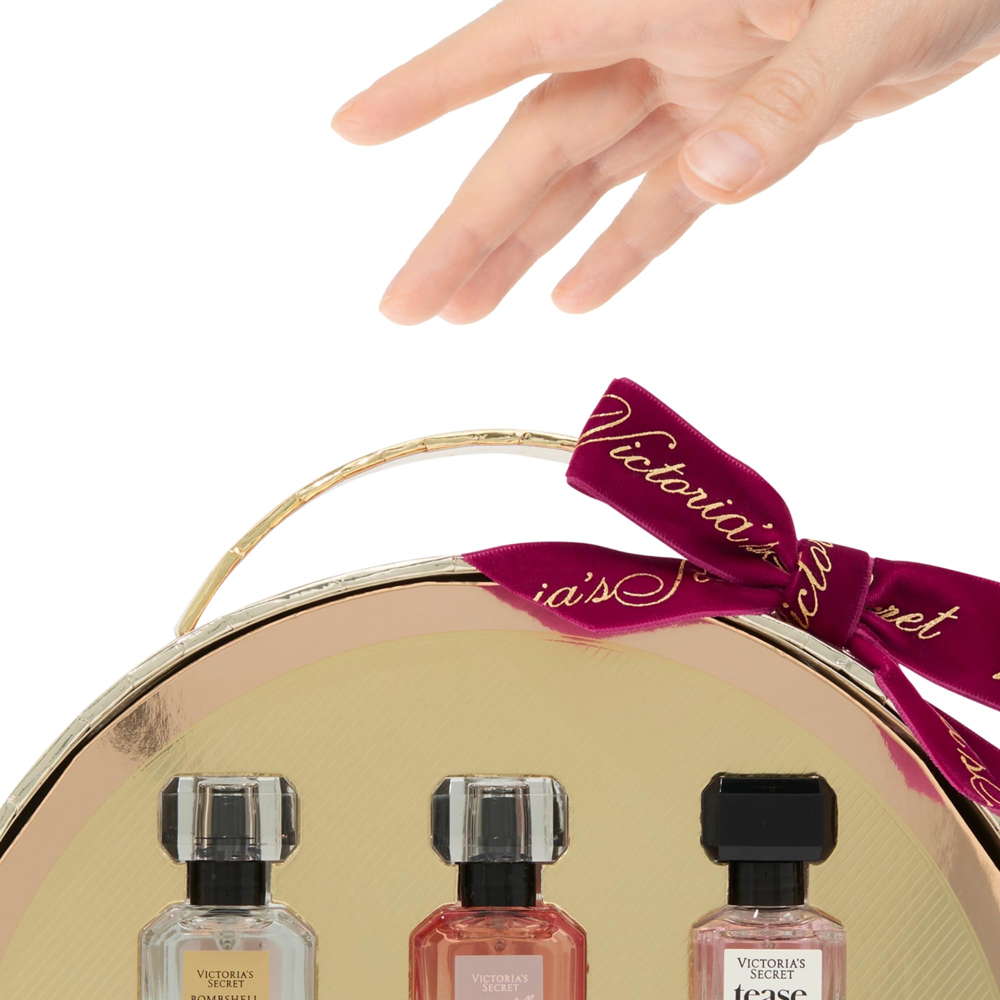 Victoria's Secret mini bottle inside travel pouch showing size next to passport benefit: convenient for travel