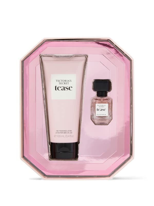Victoria's Secret Tease bottles held in hand showing compact size and easy transport