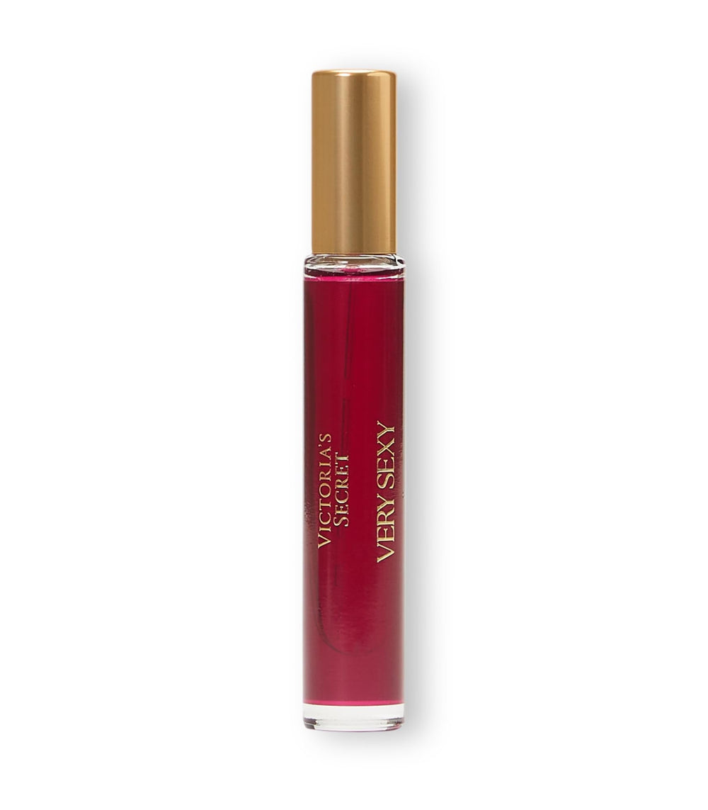 Victoria's Secret travel spray placed in a purse travel scene illustrating TSA-friendly portability