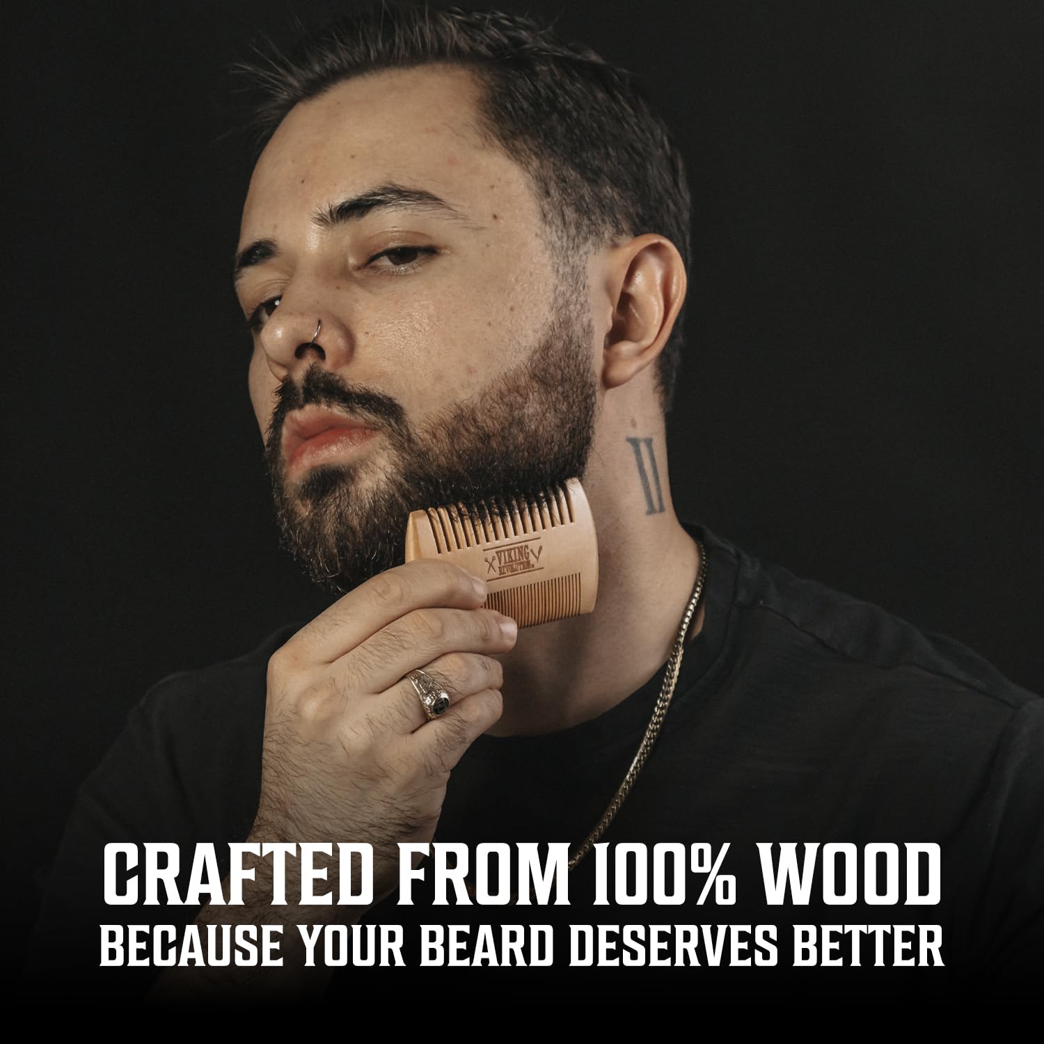 Viking Revolution beard oil dropper in hand illustrating hydration and shine benefit