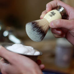 VIKINGS BLADE brush in use creating thick foam for a smooth shave benefit