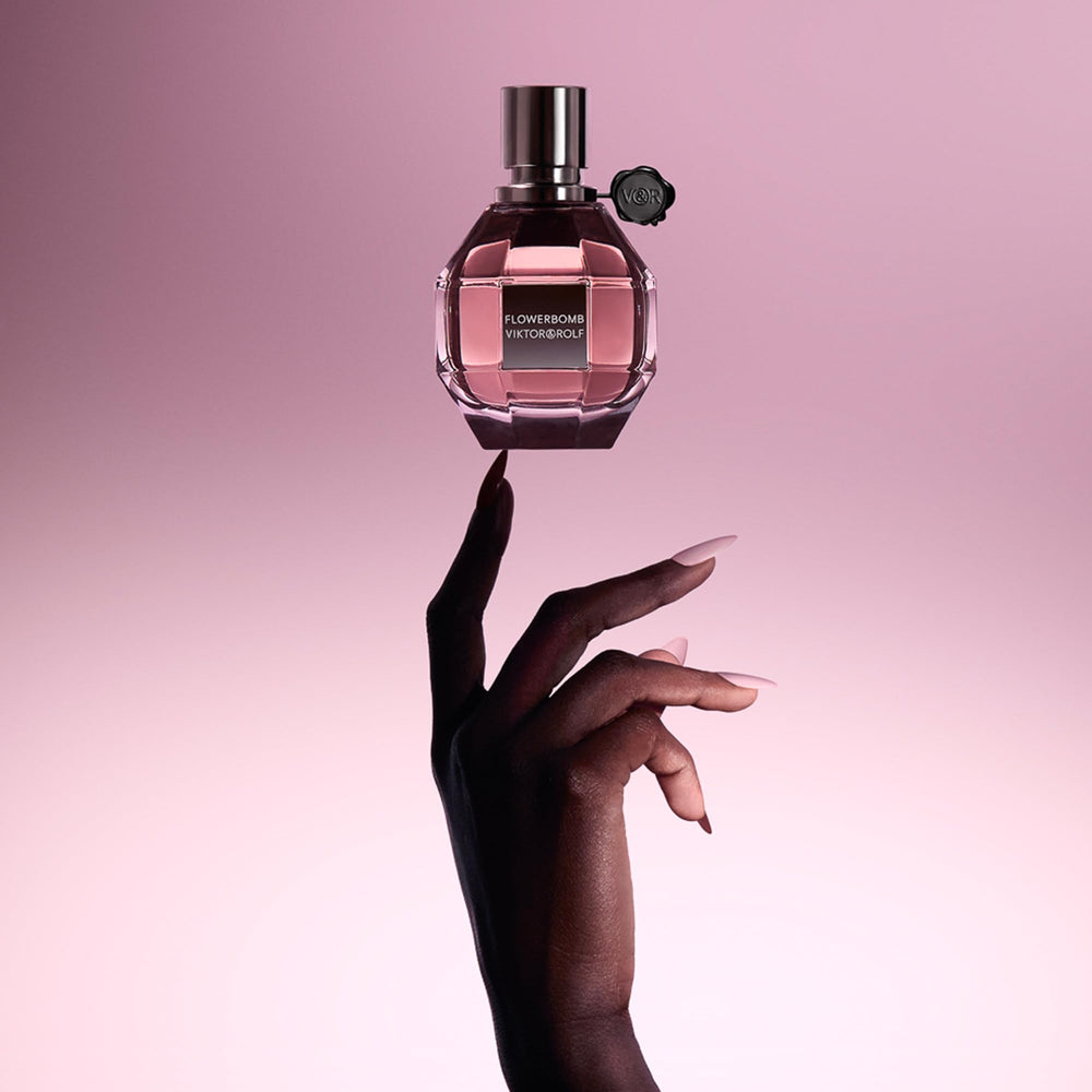 Viktor&Rolf Flowerbomb 1 fl oz beside ruler for size and travel-friendly benefit