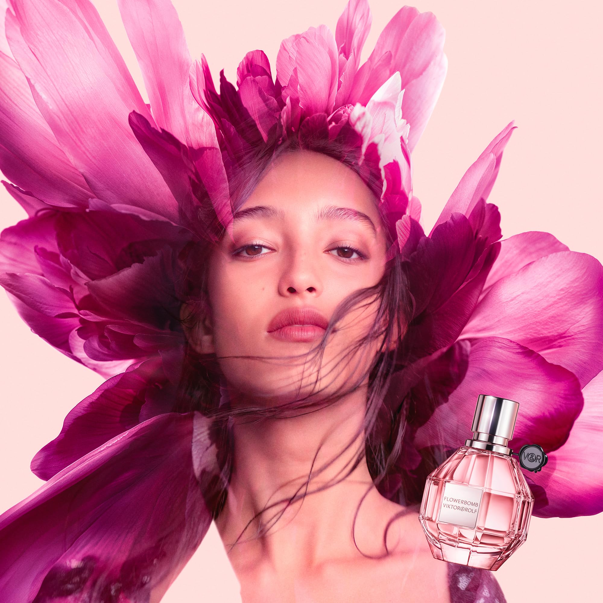Viktor&Rolf spray action in use, conveys easy application and scent release