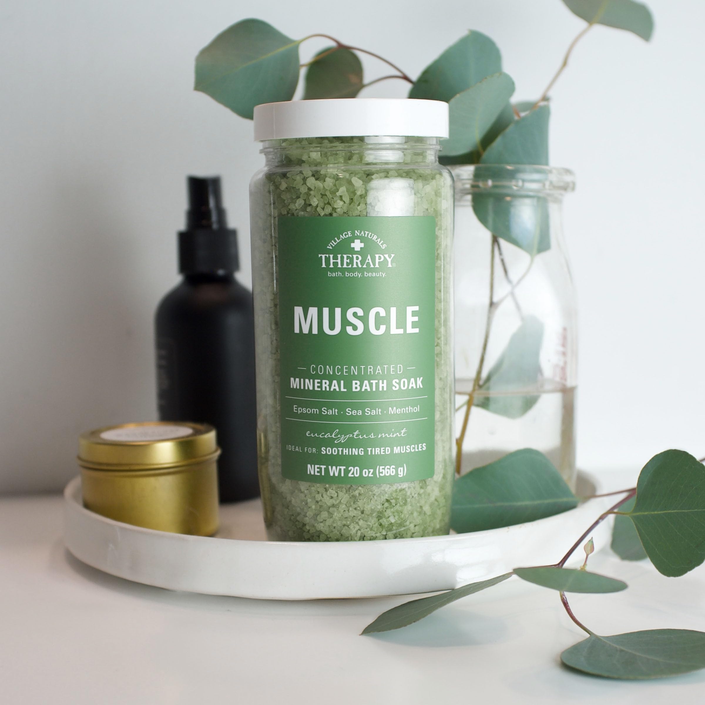 Village Naturals Therapy eucalyptus sprig with bath crystals highlighting natural-scented ingredients