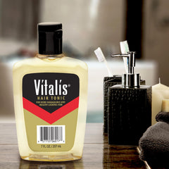 Vitalis bottle closeup label highlighting V7 formula and non-greasy benefit