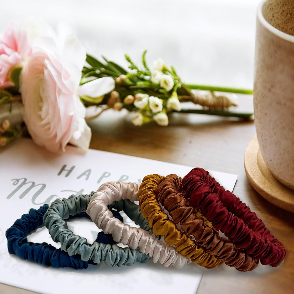 VLOMOT scrunchies shown in hand for scale, compact and travel-friendly