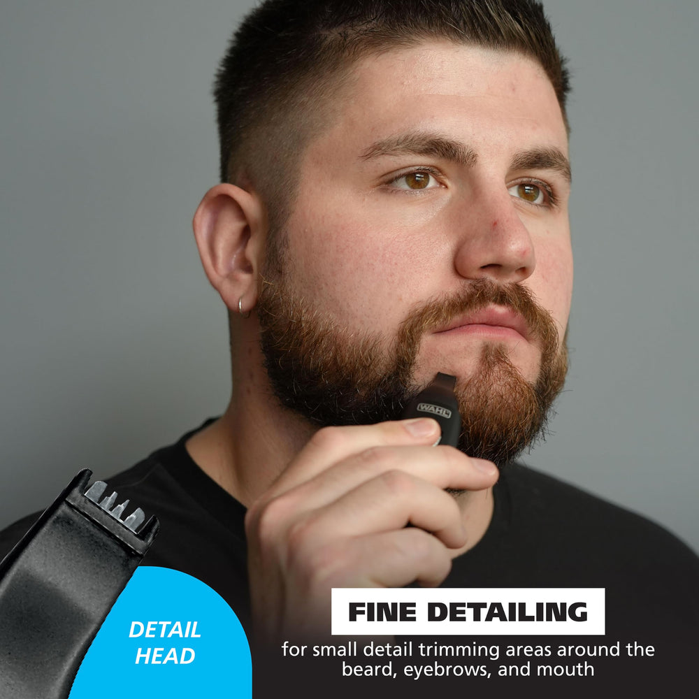 Wahl trimmer held in hand illustrating compact size for travel convenience
