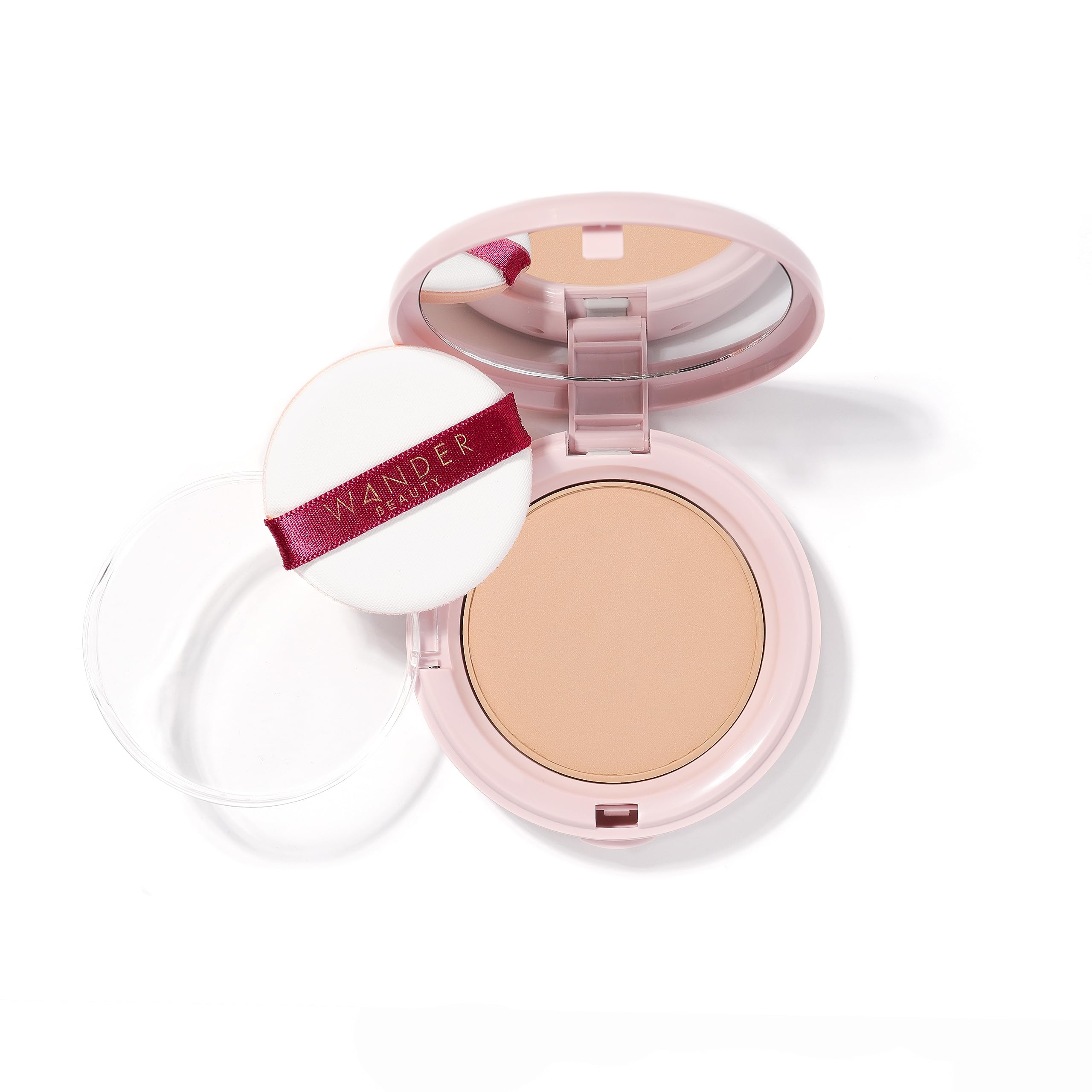 Wander Beauty compact front view showing shade Medium and portable design benefit