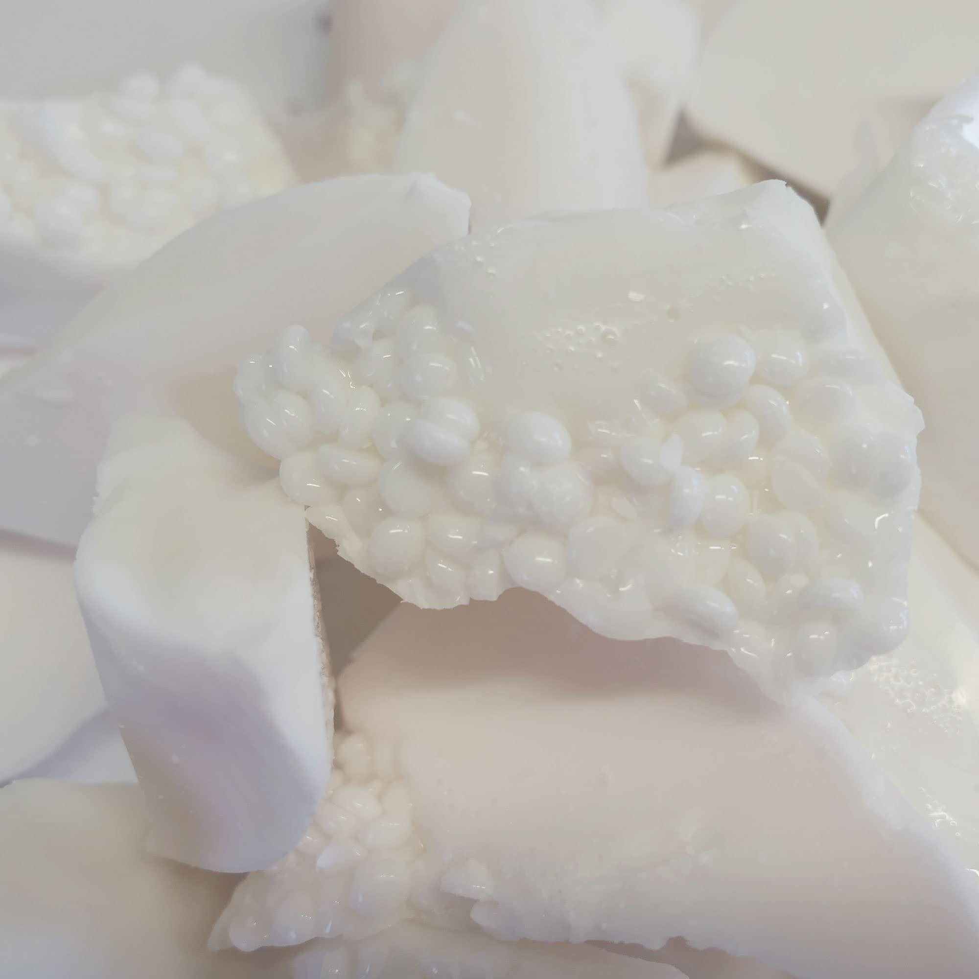 Waxness 1 kg tub beside a hand showing scale and value for busy salons