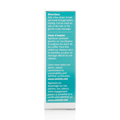 Close-up of Weleda rosemary hair oil texture on fingers showing lightweight spreadability and absorption