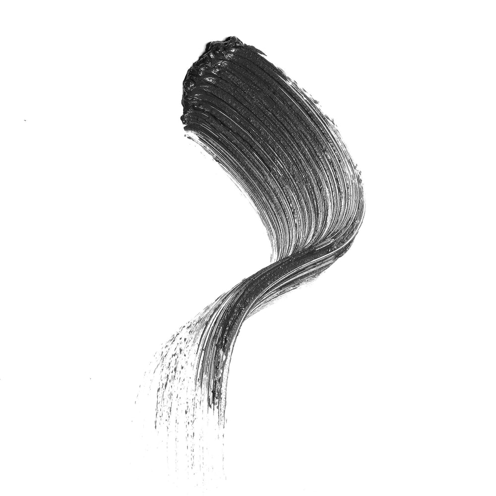 Well People mascara wand close-up highlighting molded rubber brush for precise application