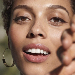 Well People brown stroke on skin demonstrating rich pigment and smooth finish