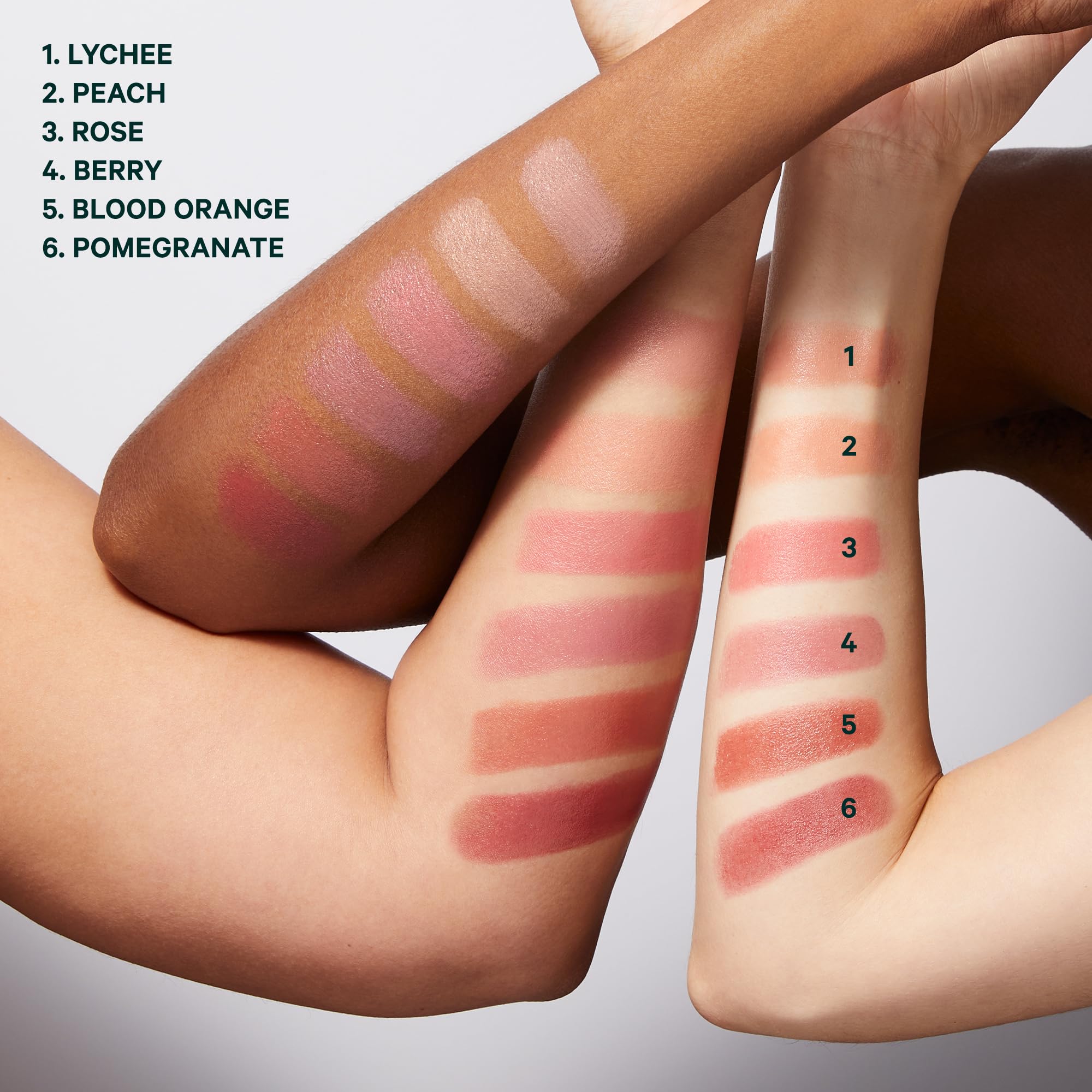 Well People applying Berry blush to cheek, demonstrating natural flushed finish
