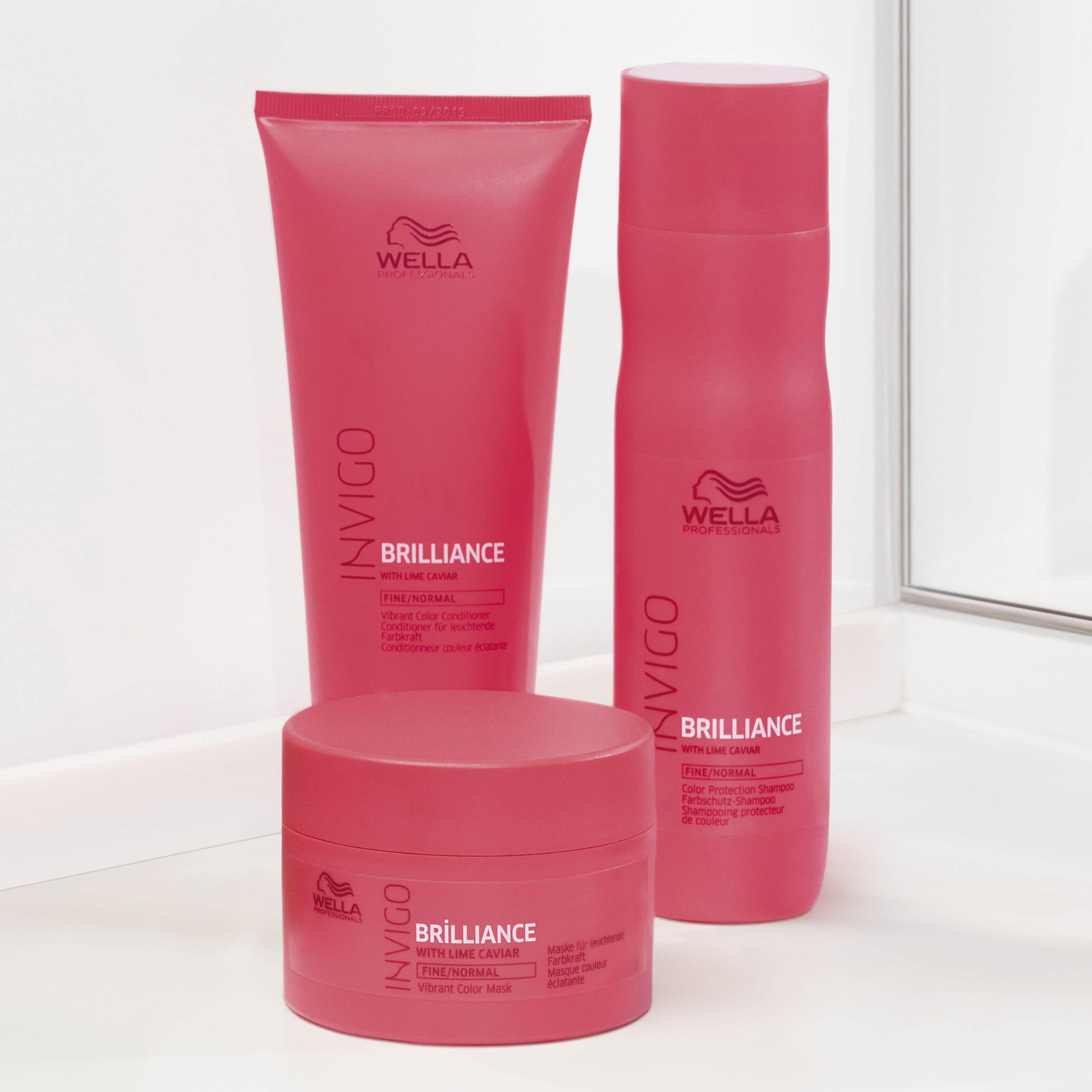 Wella Professionals salon setting with stylist using the shampoo on client