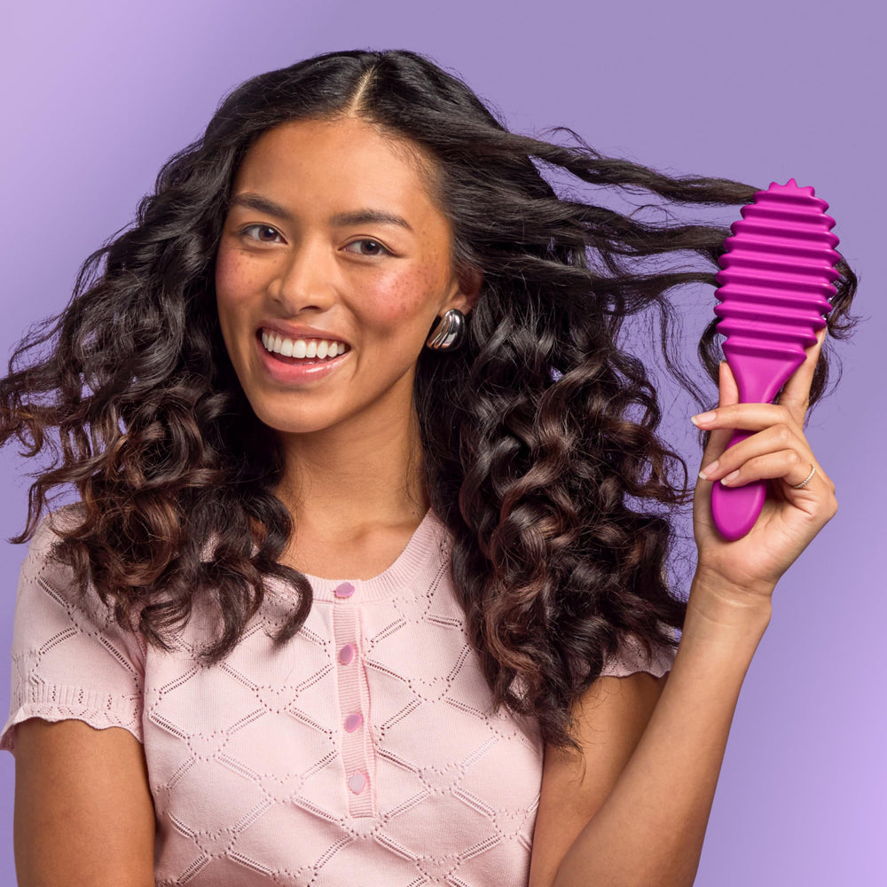 Wet Brush Curl Shaper beside conditioner bottle indicating improved slip during detangling