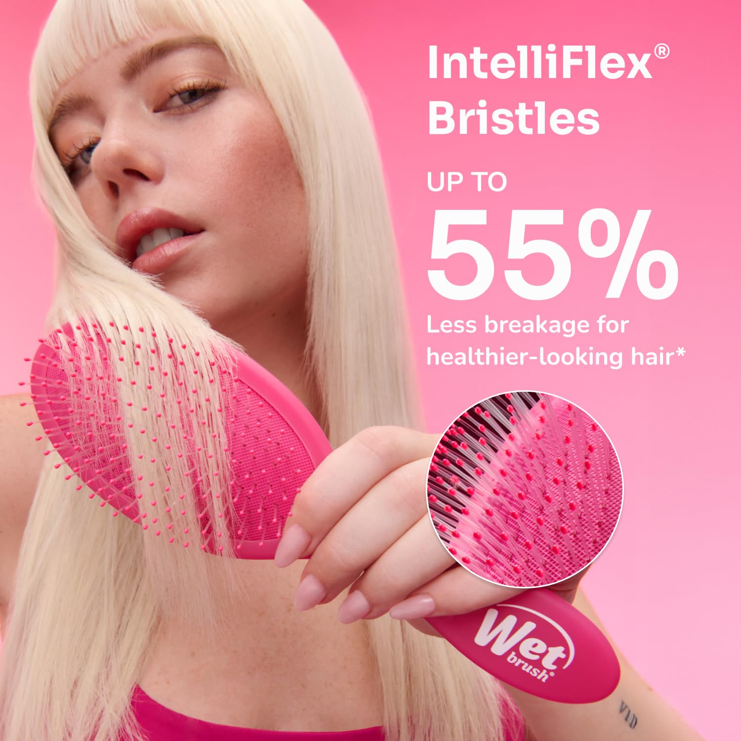 Wet Brush in hand demonstrating gentle detangling for less pain