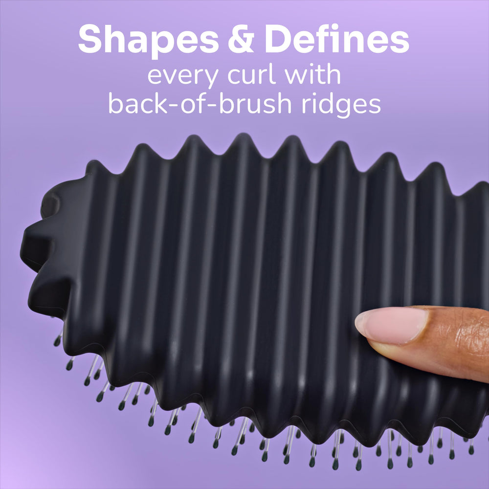 Wet Brush in shower with conditioner defining curls while wet