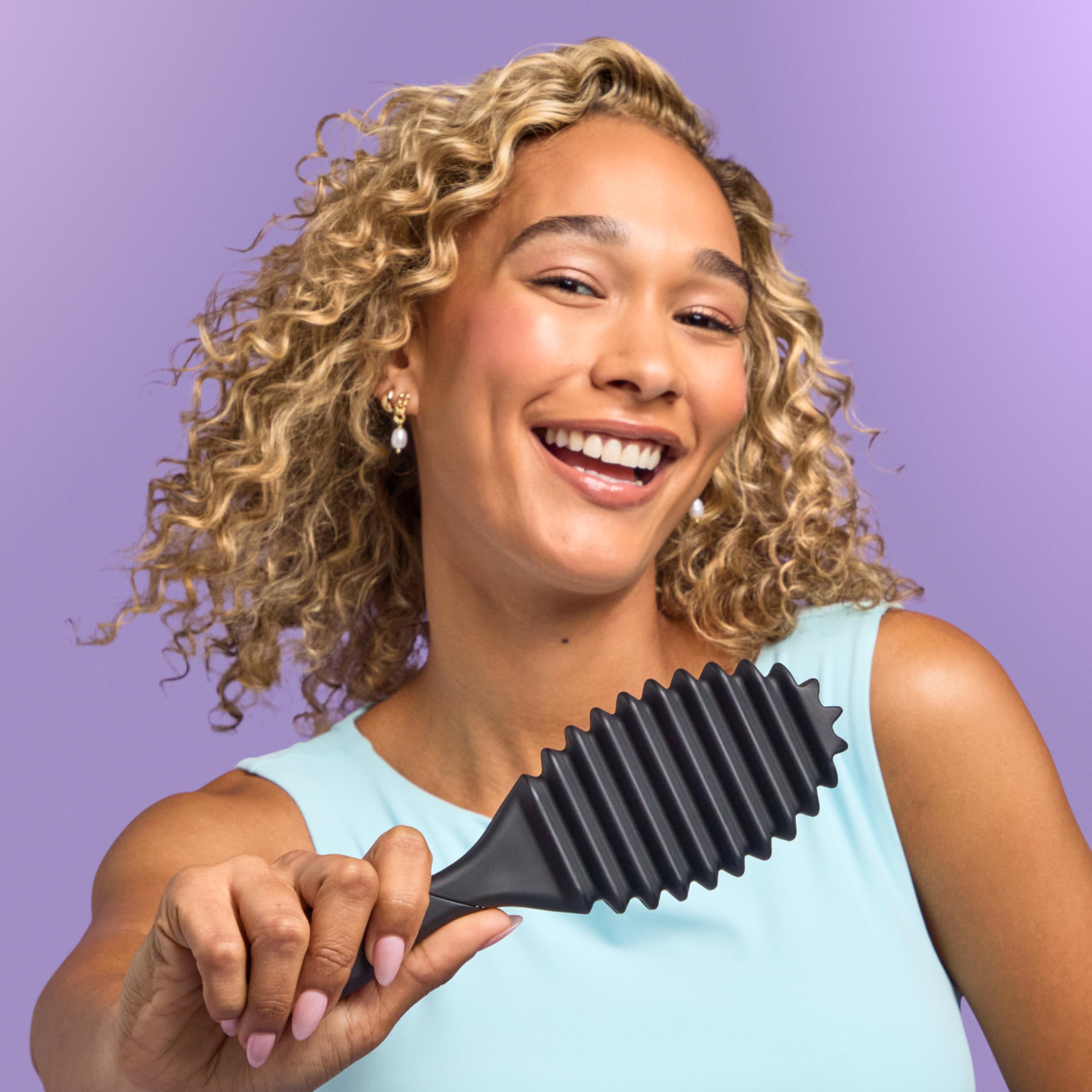 Wet Brush beside curl cream and gel showing styling product pairing