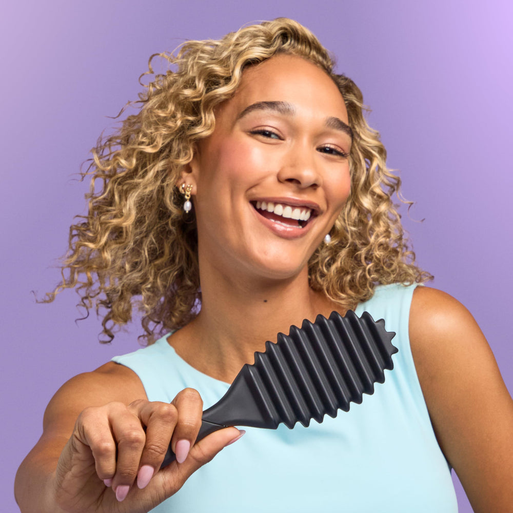 Wet Brush beside curl cream and gel showing styling product pairing