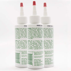 Wild Growth application closeup with fingertips applying drops for easier styling