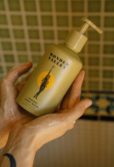 WONDER VALLEY viscous texture on hand, showing hydrating maple-syrup consistency