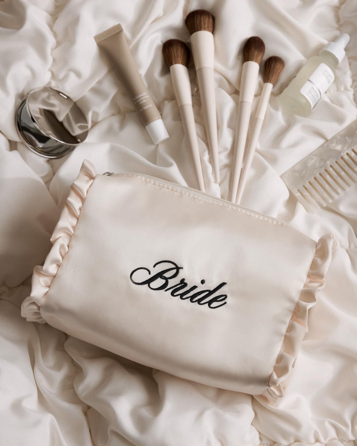 xo, Fetti close-up of black "bride" embroidery, clear celebratory branding for weddings