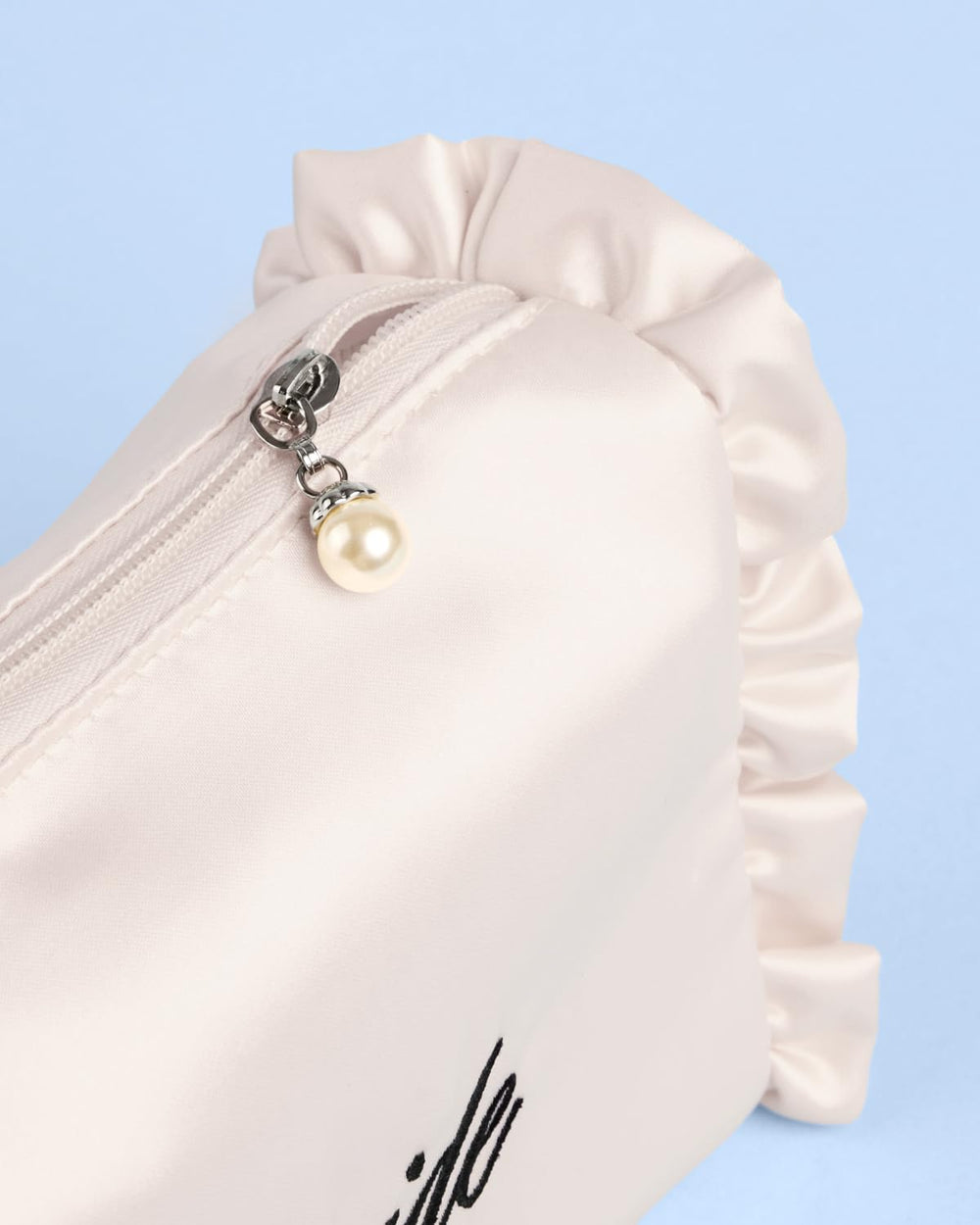 xo, Fetti opened bag with makeup inside, organized storage for wedding essentials