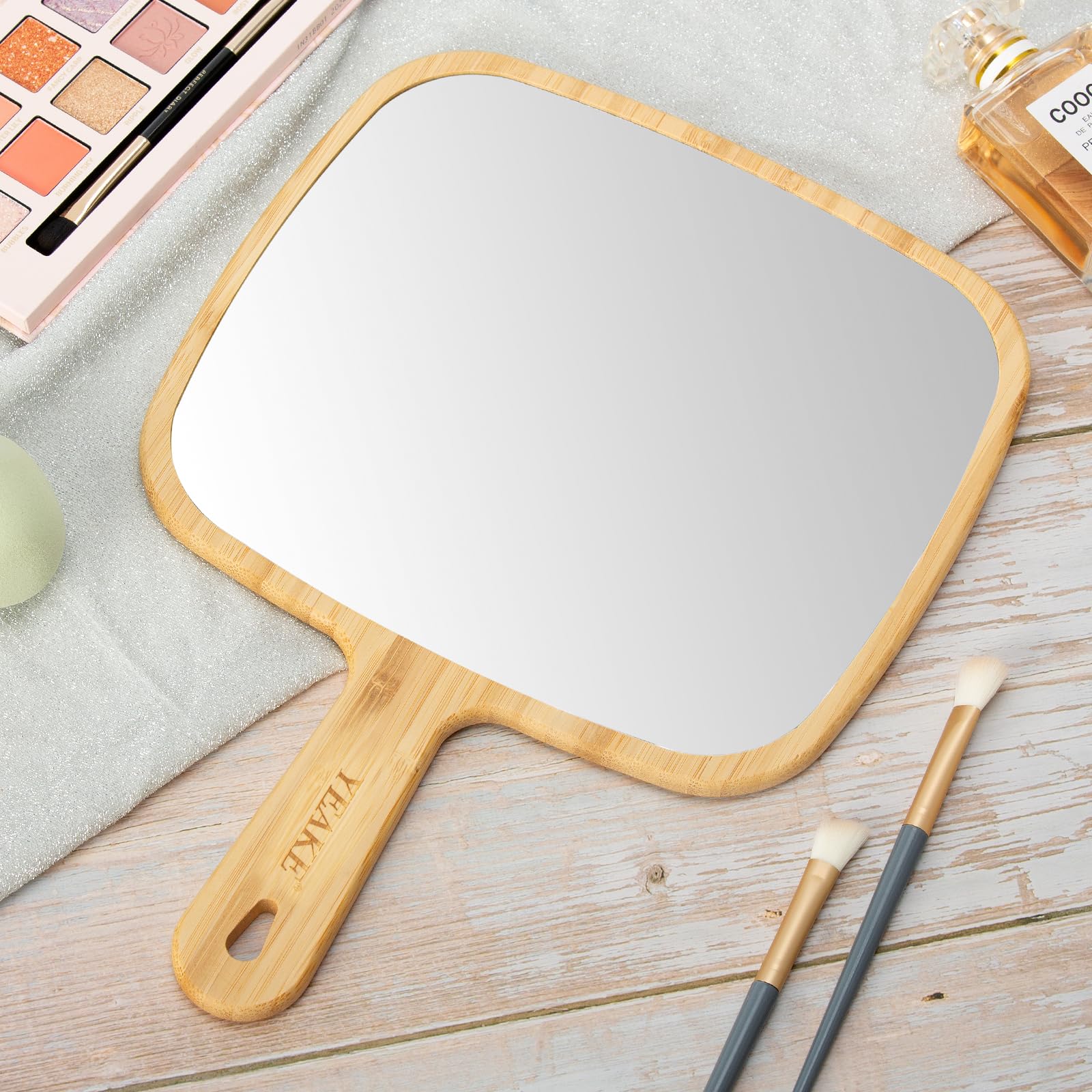 YEAKE mirror on a vanity styled scene adding natural warmth
