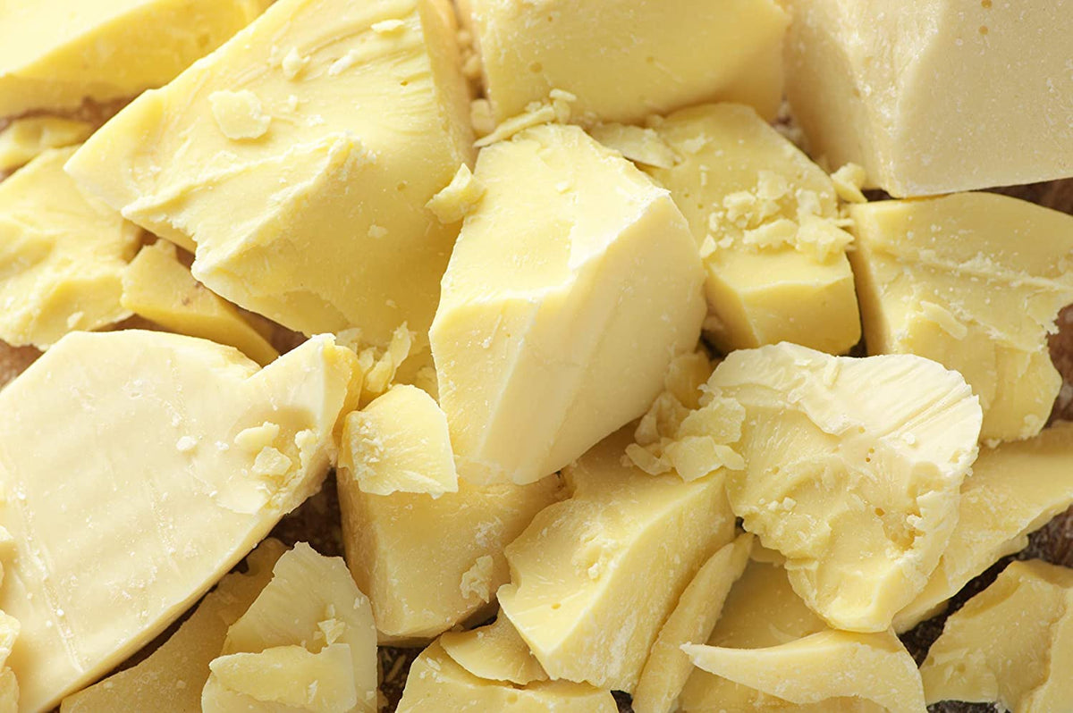 Yellow Brick Rd raw cocoa butter block front packaging showing weight and unrefined quality