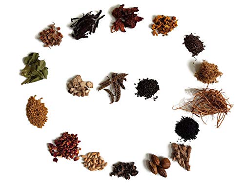 Herb pouch of YOGI’S GIFT steeping inside carrier oil to show infusion process