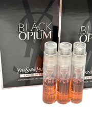 Yves Saint Laurent Black Opium set displayed in travel pouch illustrating portability and on-the-go convenience