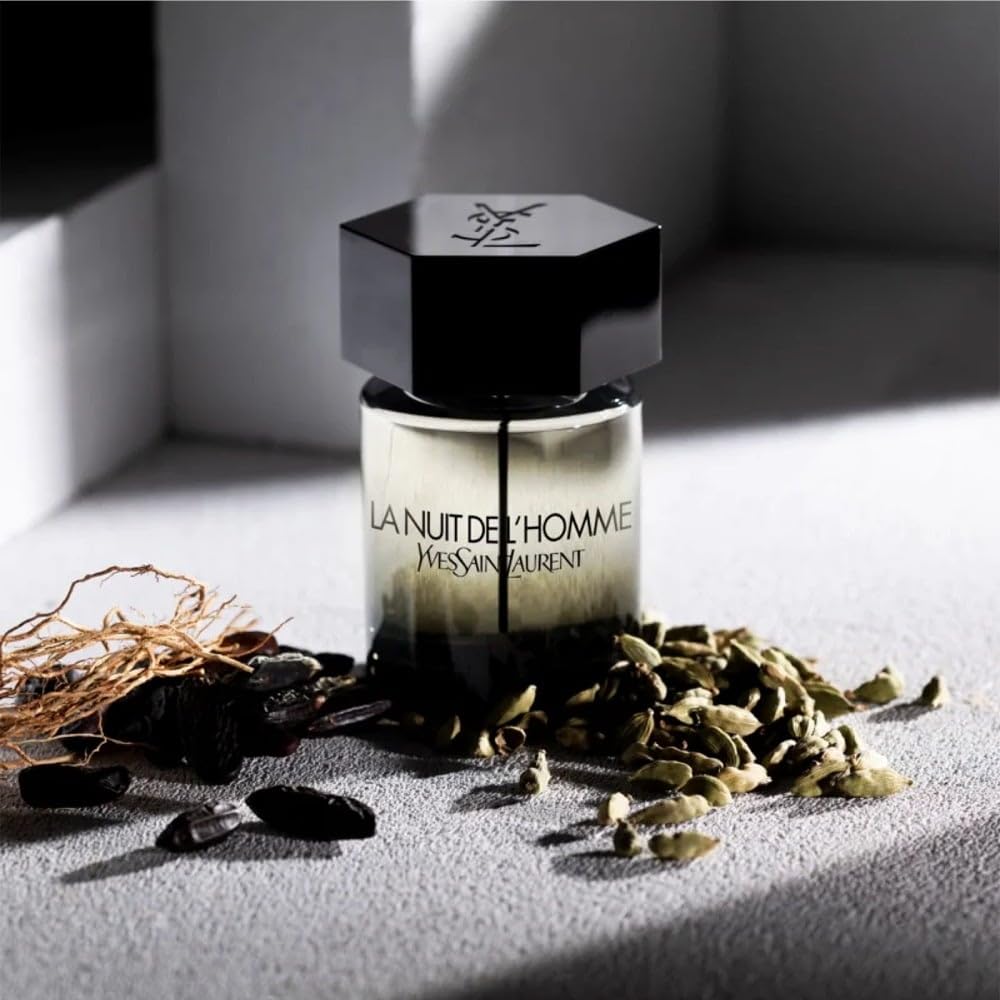 Yves Saint Laurent bottle sprayed on wrist conveying seductive evening appeal