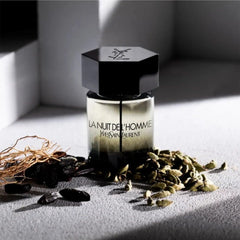 Yves Saint Laurent bottle sprayed on wrist conveying seductive evening appeal