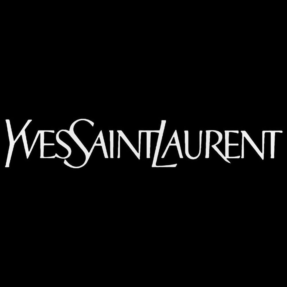 Yves Saint Laurent L'Homme spray in use on wrist demonstrating confident daytime wear