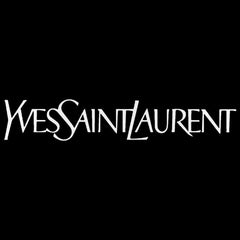 Yves Saint Laurent L'Homme spray in use on wrist demonstrating confident daytime wear