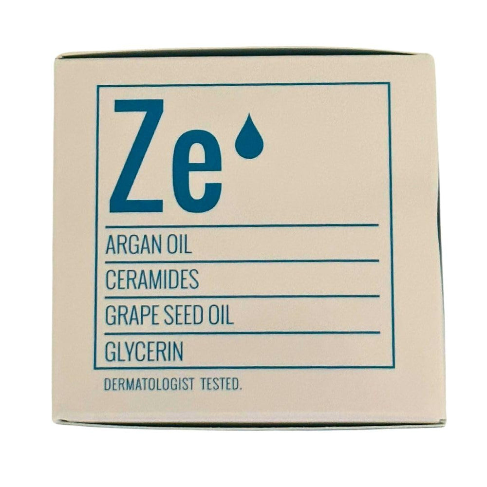 ZERAFITE 2.2 fl oz jar next to everyday items showing travel size