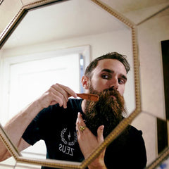 ZEUS brush in use styling beard to tame hair and shape mustache precisely