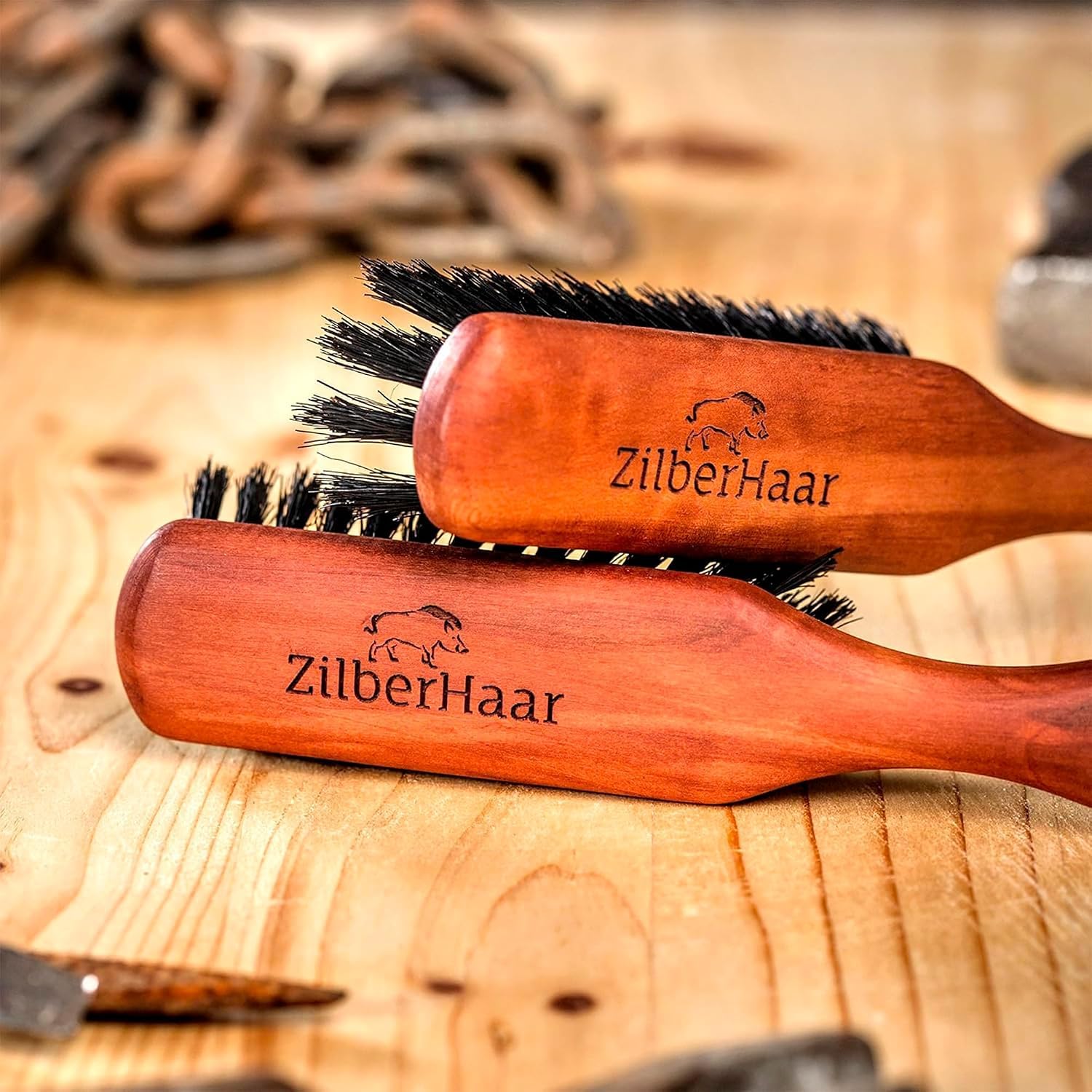 ZilberHaar brush next to oil and balm for even product distribution