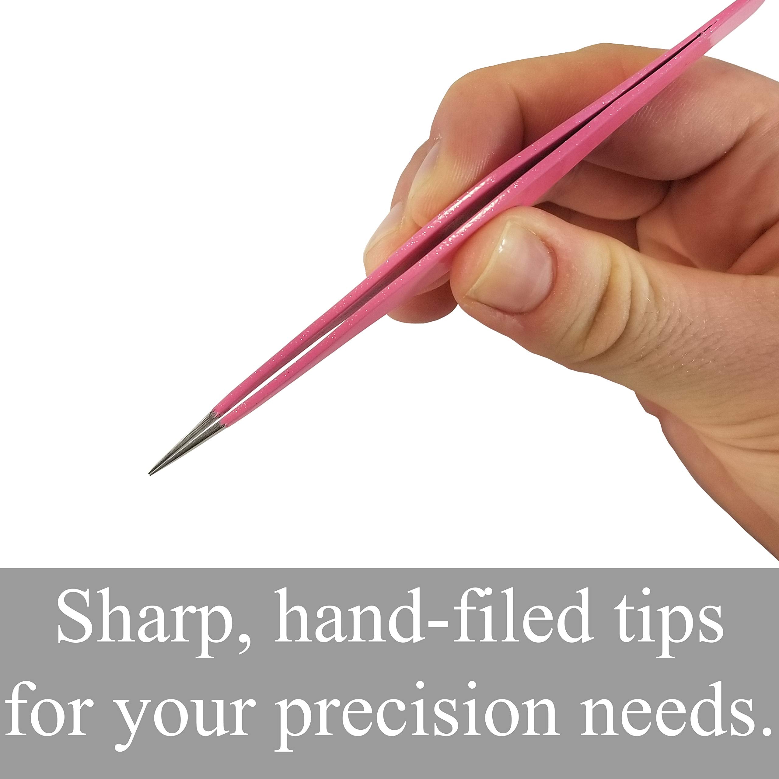 Zizzili Basics tweezers held in hand to show 4.5 inch size and ergonomic control