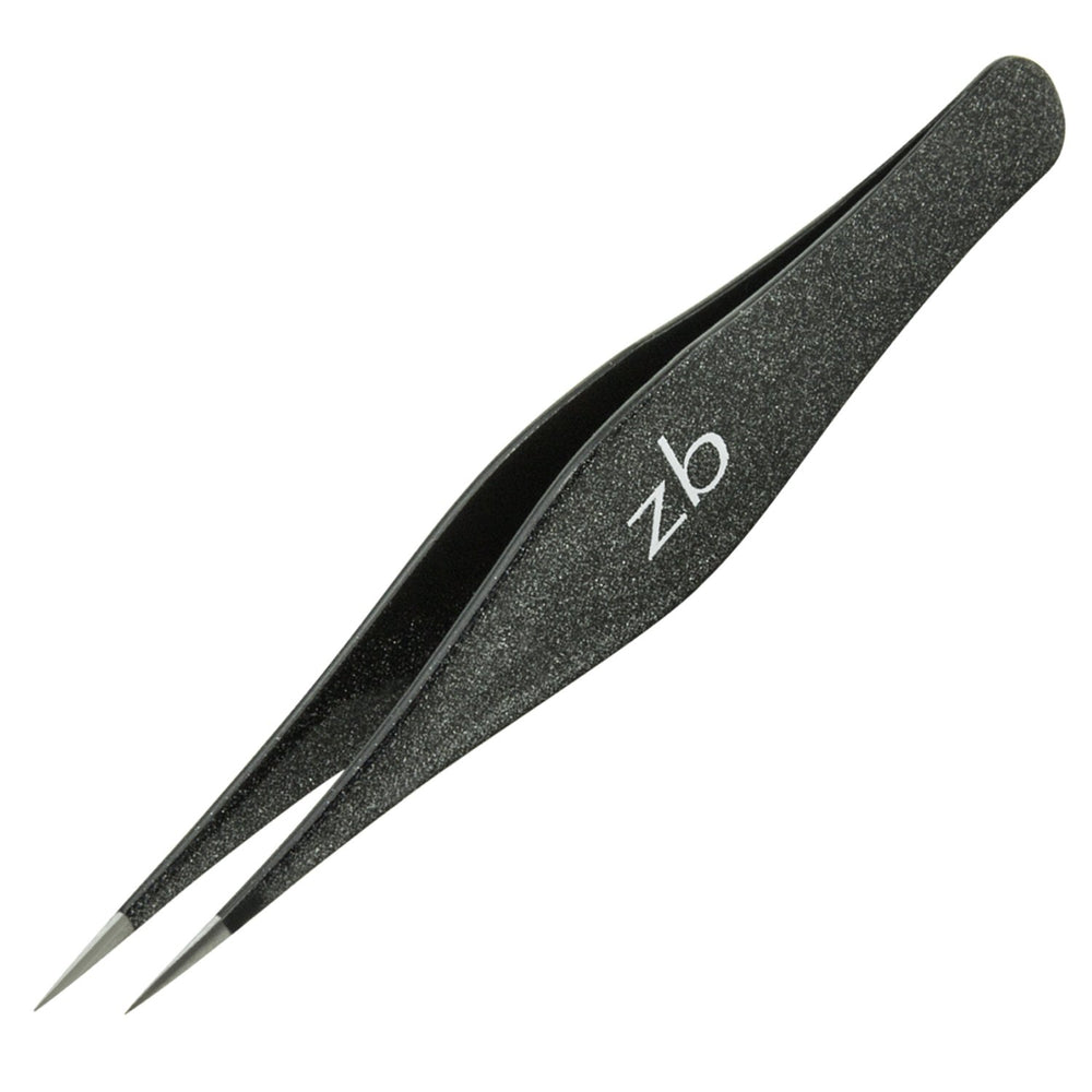 Zizzili Basics tweezers in hand for scale showing comfortable 4.5 inch control benefit