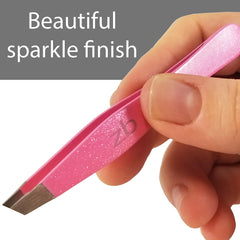 Zizzili Basics tweezers held in hand demonstrating ergonomic control